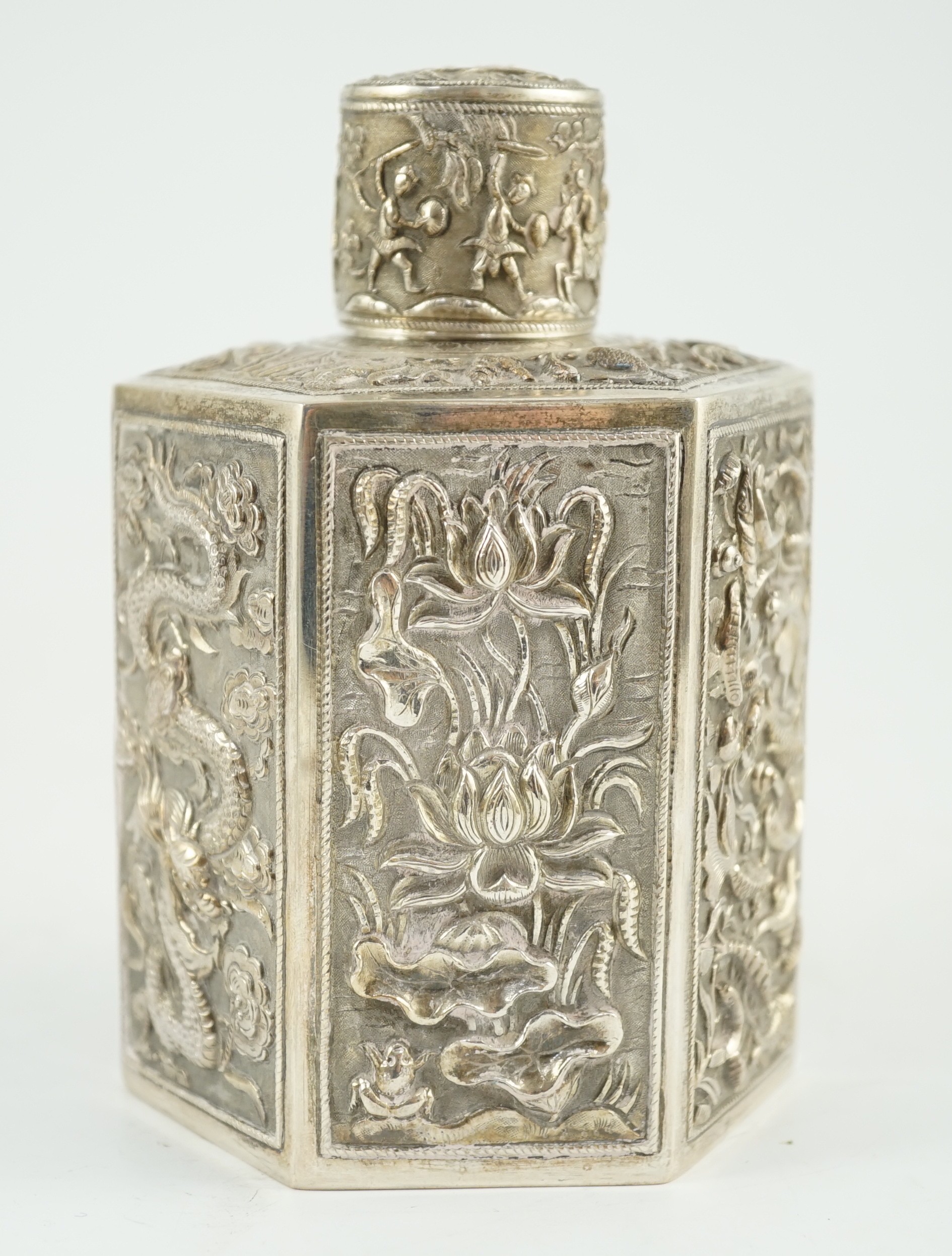 A late 19th century Chinese Export silver hexagonal tea caddy and cover, by Cumwo